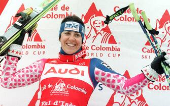 Italian Deborah Campagnoni celebrates on the podium of the the World Cup giant slalom 19 December in Val d'Isere. Compagnoni won her eighth straight World Cup giant slalom. Austrian Alexandra Meissnitzer was second, and and French Leila Piccard, third.   EPA/AFP/PASCAL PAVANI