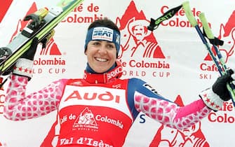 Italian Deborah Campagnoni celebrates on the podium of the the World Cup giant slalom 19 December in Val d'Isere. Compagnoni won her eighth straight World Cup giant slalom. Austrian Alexandra Meissnitzer was second, and and French Leila Piccard, third.   EPA/AFP/PASCAL PAVANI