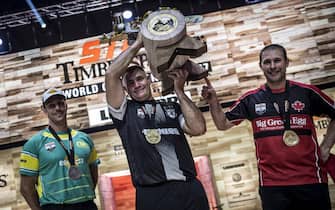 epa06310093 A handout photo made available by Global Newsroom shows Jason Wynyard of New Zealand (C) celebrates with Brad De Losa of Australia (L) and Mitch Hewitt of Canada (R) during the Award Ceremony of the Stihl Timbersports World Championships at the Hakons Hall in Lillehammer, Norway, 04 November 2017 (issued 05 November 2017).  EPA/Sebastian Marko / GLOBAL NEWSROOM / HANDOUT  HANDOUT EDITORIAL USE ONLY/NO SALES