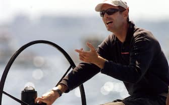 AKL05 - 20000227 - AUCKLAND, NEW ZEALAND : Skipper Francesco de Angelis of the Italian syndicate yacht Prada chats to his crew while waiting for a change in wind conditions before race four against Team New Zealand yacht NZL-60 in the America's Cup on the Hauraki Gulf in Auckland 27 February 2000.  Light wind conditions caused the postponement of the race until 29 February with Team New Zealand leading Prada in the best of nine races 3-0.   (ELECTRONIC IMAGE)      EPA PHOTO AFP/WILLIAM WEST/ww