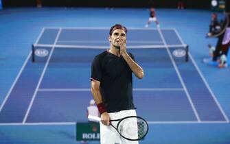 MELBOURNE, AUSTRALIA - JANUARY 24: Roger Federer of Switzerland looks at a challenge review during his Men's Singles third round match against John Millman of Australia  on day five of the 2020 Australian Open at Melbourne Park on January 24, 2020 in Melbourne, Australia. (Photo by Darrian Traynor/Getty Images)