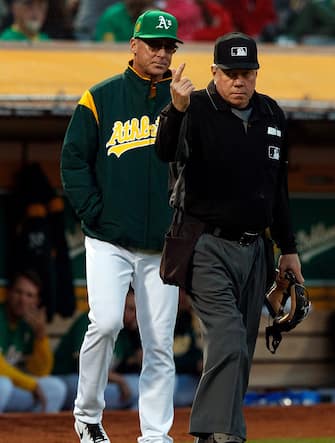 OAKLAND, CA - APRIL 20:  Bob Melvin #6 of the Oakland Athletics asks umpire Brian Gorman #9 for a video replayy review during the first inning against the Boston Red Sox at the Oakland Coliseum on April 20, 2018 in Oakland, California. The Boston Red Sox defeated the Oakland Athletics 7-3. (Photo by Jason O. Watson/Getty Images) *** Local Caption *** Bob Melvin; Brian Gorman