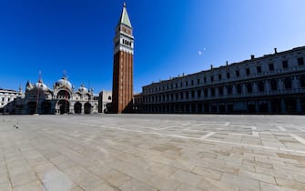 A general view shows a deserted St. Marks's Square with its basilica (L) and Bell Tower in Venice on March 18, 2020, during the country's lockdown within the new coronavirus crisis. (Photo by ANDREA PATTARO / AFP) (Photo by ANDREA PATTARO/AFP via Getty Images)