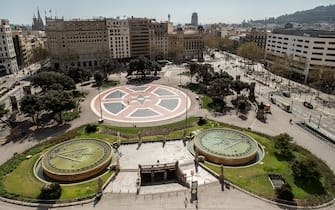 BARCELONA, SPAIN - MARCH 15: A view of an empty Catalunya Square on March 15, 2020 in Barcelona, Spain. As part of the measures against the virus expansion the Government has declared a 15-day state of emergency which will come into effect today. The Government of Spain has strengthened up its quarantine rules, shutting all commercial activities except for pharmacies, food shops, gas stations, tobacco stores and news kiosks in a bid to stop the spread of the novel coronavirus, as well as transport. Spaniards must stay home except to go to work, but working for home is recommended, going to buy basic things such as food or pharmacy products is allowed but it must be done individually. The number of people confirmed to be infected with the coronavirus (COVID-19) in Spain has increased to at least 6,391, with the latest death toll reaching 196, according to the countryâ€™s Health Ministry.  (Photo by David Ramos/Getty Images)