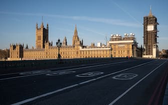LONDON, UNITED KINGDOM - MARCH 24: A general view of the Houses of Parliament as the sun rises on March 24, 2020 in London, England. British Prime Minister, Boris Johnson, announced strict lockdown measures urging people to stay at home and only leave the house for basic food shopping, exercise once a day and essential travel to and from work. The Coronavirus (COVID-19) pandemic has spread to at least 182 countries, claiming over 10,000 lives and infecting hundreds of thousands more. (Photo by Leon Neal/Getty Images)