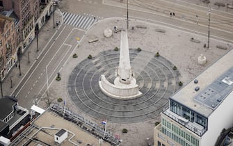 This picture taken on March 19, 2020 shows an empty Dam square downtown  Amsterdam, Netherlands, as a strict lockdown is to come into effect to stop the spread of the COVID-19, caused by the novel coronavirus. (Photo by Robin VAN LONKHUIJSEN / ANP / AFP) / Netherlands OUT (Photo by ROBIN VAN LONKHUIJSEN/ANP/AFP via Getty Images)