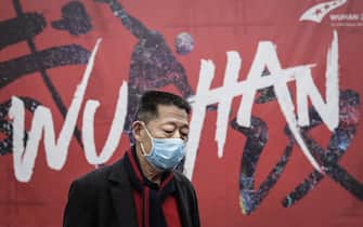 WUHAN, CHINA - JANUARY 22:  (CHINA OUT) A man wears a mask while walking in the street on January 22, 2020 in Wuhan, Hubei province, China. A new infectious coronavirus known as "2019-nCoV" was discovered in Wuhan as the number of cases rose to over 400 in mainland China. Health officials stepped up efforts to contain the spread of the pneumonia-like disease which medicals experts confirmed can be passed from human to human. The death toll has reached 17 people as the Wuhan government issued regulations today that residents must wear masks in public places. Cases have been reported in other countries including the United States, Thailand, Japan, Taiwan, and South Korea.  (Photo by Getty Images)