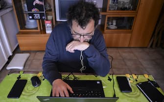 TURIN, ITALY - MARCH 23: A man works from home via smart working during the nationwide lockdown to control the coronavirus spread on March 23, 2020 in Turin, Italy. The Italian government continues to enforce the nationwide lockdown measures to control the spread of COVID-19. (Photo by Diego Puletto/Getty Images)