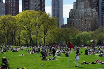 NEW YORK, NY - MAY 02: People fill Sheep Meadow in Central Park during the coronavirus pandemic on May 2, 2020 in New York City. COVID-19 has spread to most countries around the world, claiming over 244,000 lives with over 3.4 million infections reported. (Photo by Cindy Ord/Getty Images)
