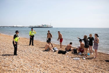 BRIGHTON, ENGLAND  - MAY 09: Police patrol the beach on May 09, 2020 in Brighton, England.  Officers are asking people to observe lockdown rules, and asking people who aren't to leave. The UK is continuing with quarantine measures intended to curb the spread of Covid-19, but as the infection rate is falling government officials are discussing the terms under which it would ease the lockdown. (Photo by Luke Dray/Getty Images)