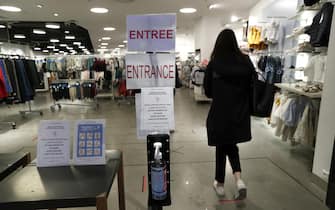 epa08414169 Free hand sanitizer is available at the entrance of a clothing store in a mall in Montpellier, France, 11 May 2020. France began a gradual easing of its lockdown measures and restrictions amid the COVID-19 pandemic.  EPA/GUILLAUME HORCAJUELO
