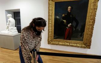 A member of staff prepares exhibition rooms at The Musee Hyacinthe Rigaud in Perpignan on May 11, 2020, in readiness to receive visitors after the partial lifting of restrictions on movement in France which were in place to attempt to halt the spread of the new coronavirus (COVID-19). (Photo by RAYMOND ROIG / AFP) / RESTRICTED TO EDITORIAL USE - MANDATORY MENTION OF THE ARTIST UPON PUBLICATION - TO ILLUSTRATE THE EVENT AS SPECIFIED IN THE CAPTION