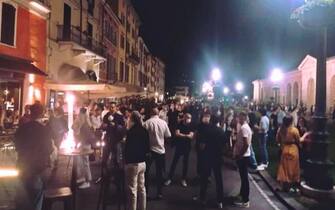 People don't comply with social distancing regulations while gathering in piazzale Arnaldo during nightlife in Brescia, northern Italy, 22 May 2020 (issued 23 May 2020). 'It is not time for youth street parties known as 'movida' or else the coronavirus infection curve may start heading back up again', Italian Premier Giuseppe Conte said on 20 May. Italy is gradually easing lockdown measures implemented to stem the spread of the SARS-CoV-2 coronavirus that causes the COVID-19 disease.
ANSA/ FILIPPO VENEZIA