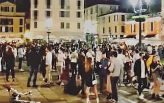 People don't comply with social distancing regulations while gathering in piazzale Arnaldo during nightlife in Brescia, northern Italy, 22 May 2020 (issued 23 May 2020). 'It is not time for youth street parties known as 'movida' or else the coronavirus infection curve may start heading back up again', Italian Premier Giuseppe Conte said on 20 May. Italy is gradually easing lockdown measures implemented to stem the spread of the SARS-CoV-2 coronavirus that causes the COVID-19 disease.
ANSA/ FILIPPO VENEZIA