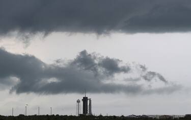 CAPE CANAVERAL, FLORIDA - MAY 27: Dark clouds hang over the SpaceX Falcon 9 rocket with the manned Crew Dragon spacecraft on launch pad 39A at the Kennedy Space Center on May 27, 2020 in Cape Canaveral, Florida. The inaugural flight will be the first manned mission since the end of the Space Shuttle program in 2011 to be launched into space from the United States. (Photo by Joe Raedle/Getty Images)