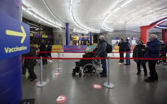 1231473990 People arrive to be vaccinated at the Olympic Stadium in Montreal, Quebec, Canada, on Tuesday, March 2, 2021. The mass vaccination centers at the Palais des Congres and Olympic Stadium each have the capacity to administer 3,000 vaccines per day. Photographer: Christinne Muschi/Bloomberg via Getty Images