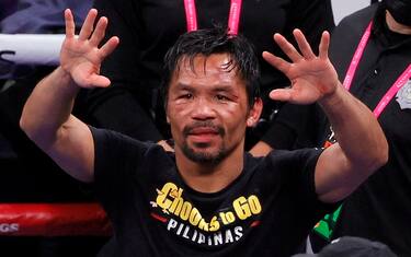 LAS VEGAS, NEVADA - AUGUST 21:  Manny Pacquiao gestures to fans after his WBA welterweight title fight against Yordenis Ugas at T-Mobile Arena on August 21, 2021 in Las Vegas, Nevada. Ugas retained his title by unanimous decision.  (Photo by Ethan Miller/Getty Images)