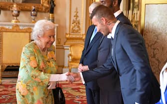 Queen Elizabeth II meets David Beckham at Buckingham Palace before the final Queen's Young Leaders Awards Ceremony.