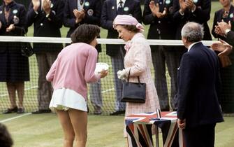 The Queen talking to Britain's Virginia Wade after presenting her with the trophy as Women's Singles Champion. Wade beat Betty Stove of the Netherlands 4-6 6-3 6-1.