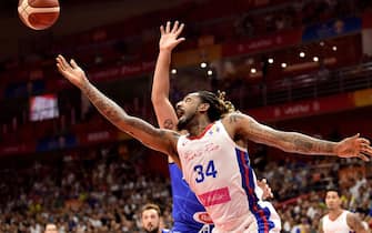 TOPSHOT - Puerto Rico's Renaldo Balkman goes to the basket during the Basketball World Cup Group J second round game between Puerto Rico and Italy in Wuhan on September 8, 2019. (Photo by HECTOR RETAMAL / AFP)        (Photo credit should read HECTOR RETAMAL/AFP via Getty Images)