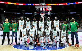 DONGGUAN, CHINA - SEPTEMBER 01: Coach Moustapha Gaye and players of Senegal line up for team photo during the 2019 FIBA World Cup, first round match between Senegal and Lithuania at Dongguan Basketball Center on September 01, 2019 in Dongguan, China. (Photo by Zhizhao Wu/Getty Images)