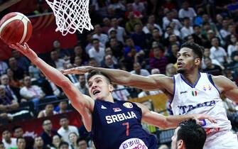 FOSHAN, CHINA - SEPTEMBER 04: #7 Bogdan Bogdanovic of the Serbia National Team in action against #15 Jeff Brooks of the Italy National Team during the 1st round of 2019 FIBA World Cup at GBA International Sports and Cultural Center on September 4, 2019 in Foshan, China. (Photo by Zhong Zhi/Getty Images)