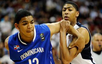LAS VEGAS, NV - JULY 12:  Karl Towns #12 (L) of the Dominican Republic and Anthony Davis #14 of the US Men's Senior National Team tussle for a rebound during a pre-Olympic exhibition game at Thomas & Mack Center on July 12, 2012 in Las Vegas, Nevada. Davis was a last minute replacement for injured Blake Griffin.  (Photo by David Becker/Getty Images)