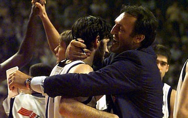 PIR14-19980803-PIRAEUS, GREECE: Dino Meneghin (R), former Italian basketball star, embraces his son Andrea (C) after Italy defeated Yugoslavia 61-60 in their match for the World Basketball Championship in Piraeus, near Athens 03 August.  (ELECTRONIC IMAGE-BEST QUALITY AVAILABLE)   EPA PHOTO  Srdjan SUKI
