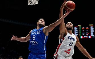 BOLOGNA, ITALY - AUGUST 12: Danilo Gallinari (L) #8 of Italy is challenged by Rudy Gobert (R) #27 of France during the basketball International Friendly match between Italy and France at Unipol Arena on August 12, 2022 in Bologna, Italy. (Photo by Giuseppe Cottini/Getty Images)