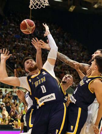 Bosnia and Herzegovina's Jusuf Nurkic (L) blocks an attack by France's Vincent Poirier during Europe's qualifiers basketball match for the FIBA Basketball World Cup 2023, second round basketball game between Bosnia and France in Sarajevo on August 27, 2022. (Photo by ELVIS BARUKCIC / AFP) (Photo by ELVIS BARUKCIC/AFP via Getty Images)
