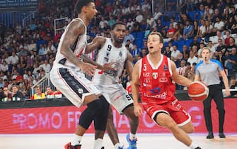 Kevin Pangos (EA7 Emporio Armani Olimpia Milano) thwarted by Jaleen Smith (Virtus Segafredo Bologna)  during  EA7 Emporio Armani Milano vs Virtus Segafredo Bologna, Italian Basketball Supercup match in Brescia, Italy, September 23 2023