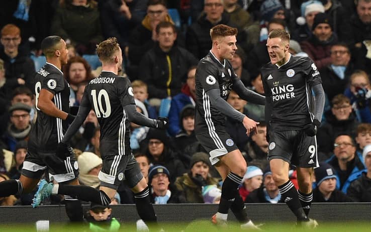 Leicester City's English striker Jamie Vardy (R) celebrates with teammates after scoring the opening goal of the English Premier League football match between Manchester City and Leicester City at the Etihad Stadium in Manchester, north west England, on December 21, 2019. (Photo by Oli SCARFF / AFP) / RESTRICTED TO EDITORIAL USE. No use with unauthorized audio, video, data, fixture lists, club/league logos or 'live' services. Online in-match use limited to 120 images. An additional 40 images may be used in extra time. No video emulation. Social media in-match use limited to 120 images. An additional 40 images may be used in extra time. No use in betting publications, games or single club/league/player publications. /  (Photo by OLI SCARFF/AFP via Getty Images)