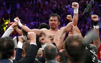 1163275165 LAS VEGAS, NEVADA - JULY 20: Manny Pacquiao celebrates his split decision victory over Keith Thurman in their WBA welterweight title fight at MGM Grand Garden Arena on July 20, 2019 in Las Vegas, Nevada. (Photo by Steve Marcus/Getty Images)