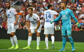 Lyon's Portuguese goalkeeper Anthony Lopes (R) gestures past Lyon's French midfielder Lucas Tousart (L) and Lyon's Danish defender Joachim Andersen (2ndL) during the French L1 football match between Montpellier Herault SC and Olympique Lyonnais at the Mosson stadium in Montpellier, southern France, on August 27, 2019. (Photo by PASCAL GUYOT / AFP)        (Photo credit should read PASCAL GUYOT/AFP via Getty Images)