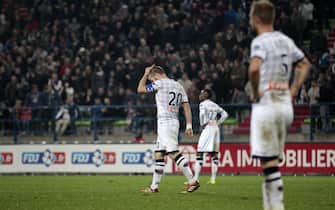 Clermont's players reacts after losing a French League Cup football match between Caen (SM Caen) and Clermont (Clermont Foot Auvergne) on October 28, 2014 at the Michel d'Ornano stadium in Caen, western France.    AFP PHOTO / CHARLY TRIBALLEAU        (Photo credit should read CHARLY TRIBALLEAU/AFP via Getty Images)