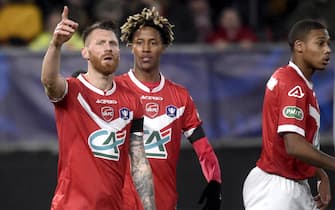 Valenciennes' Teddy Chevalier (L) celebrates after scoring a penalty during the French Cup football match between Valenciennes (L2) and Dijon (L1) on January 5, 2020 at the Hainaut Stadium in Valenciennes. (Photo by FRANCOIS LO PRESTI / AFP) (Photo by FRANCOIS LO PRESTI/AFP via Getty Images)