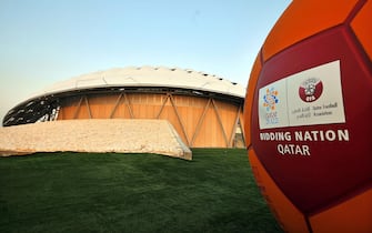 epa07655101 (FILE) - The FIFA 2022 World Cup bid logo on display in front of a showcase stadium built with zero carbon, solar powered cooling technology for open-air stadiums in Doha, Qatar, 14 September 2010 (re-issued 18 June 2019). Former UEFA president Michel Platini has been arrested as part of an investigation in the Qatar 2022 World Cup bid, media reports claimed on 18 June 2019. Platini is believed to have been taken to the office of the Anti-Corruption Office of the Judicial Police (OCLCIFF) in Nanterre, near Paris, France.  EPA/STRINGER *** Local Caption *** 51814321