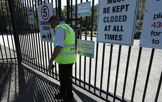 GOSFORD, AUSTRALIA - MARCH 20: A security guard at the entrance to the stadium during the round 24 A-League match between the Central Coast Mariners and Melbourne City at Central Coast Stadium on March 20, 2020 in Gosford, Australia. (Photo by Tony Feder/Getty Images)