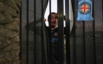GOSFORD, AUSTRALIA - MARCH 20: Melbourne City fan looks on from outside the stadium due to the lockout from coronavirus during the round 24 A-League match between the Central Coast Mariners and Melbourne City at Central Coast Stadium on March 20, 2020 in Gosford, Australia. (Photo by Ashley Feder/Getty Images)