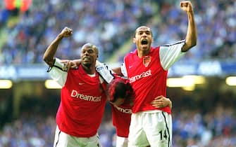 CARDIFF,WALES -MAY 4:  Freddie Ljungberg celebrates scoring Arsenal's 2nd goal with Thierry Henry and Sylvain Wiltord during the FA Cup Final match between Arsenal and Chelsea on May 4, 2002 in Cardiff, Wales. (Photo by Stuart MacFarlane/Arsenal FC via Getty Images)