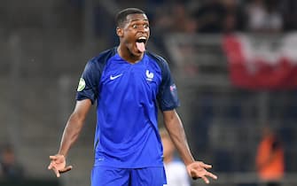 epa05439589 French player Issa Diop celebrates scoring the 4-0 during the final of the UEFA U19 European Championship between France and Italy in Sinsheim, Germany, 24 July 2016.  EPA/Uwe Anspach