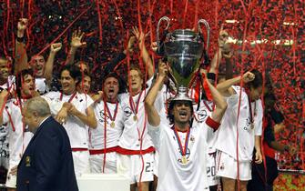 AC Milan captain Paolo Maldini (C) holds the Champions League trophy while celebrating with his teammates after defeating Juventus Turin during their Champions League soccer final in Manchester, Wednesday 28 May 2003. At left UEFA President Lennart Johansson. AC Milan defeated Juve 3-2 after penalty shootout to win the European Champion Club's Cup trophy for the sixth time in their history.   EPA-PHOTO/EPA/GERRY PENNY