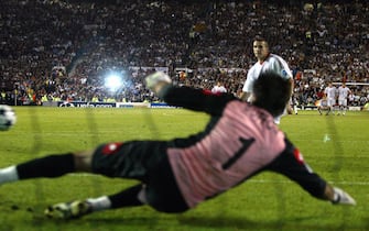 Ukrainian striker Andriy Shevchenko (background) of AC Milan scores the last penalty against Juventus Turin goalkeeper Gianluigi Buffon during their Champions League soccer final in Manchester, Wednesday 28 May 2003. AC Milan defetaed Juve 3-2 after penalty shootout to win the European Champion Club's Cup trophy for the sixth time in their history.   EPA-PHOTO/ANSA/FILIPPO MONTEFORTE