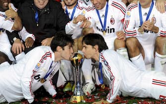 Italian club AC Milan's Kaka (L bottom) and Filippo Inzaghi (R bottom) kiss to the trophy as they celebrate their victory after beating Argentine club Boca Juniors in the FIFA Club World Cup final at Yokohama International Stadium, south of Tokyo, Japan, 16, December, 2007. 
ANSA/KIMIMASA MAYAMA