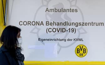 DORTMUND, GERMANY - APRIL 04: (BILD ZEITUNG OUT) A woman at the entrance to the Corona treatment center in the area the north grandstand from the SIGNAL IDUNA PARK on April 04, 2020 in Dortmund. The Bundesliga club Borussia Dortmund announced on Friday April 3, 2020 that it is providing the area the north grandstand of Germany's largest football stadium together with the Statutory Health Insurance Association of Westphalia-Lippe (KVWL) for coronavirus tests. (Foto by Alex Gottschalk/DeFodi images via via Getty Images)
