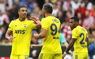 epa07750175 Fenerbahce's Nabil Dirar (L) celebrates with his teammates after scoring the 2-2 equalizer during the Audi Cup third place soccer match between Real Madrid and Fenerbahce Istanbul in Munich, Germany, 31 July 2019.  EPA/RONALD WITTEK
