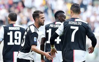Juventus Miralem Pjanic jubilates with teammates after scoring the goal (1-0) during the italian Serie A soccer match Juventus FC vs S.P.A.L at Allianz stadium in Turin, Italy, 28 september 2019  ANSA/ ALESSANDRO DI MARCO