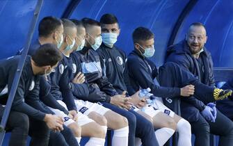 epa08453101 Rad substitute players wear protective face masks before the Serbian SuperLiga soccer match between Rad and Red Star in Belgrade, Serbia, 29 May 2020. The Serbian SuperLiga resumes without spectators after a suspension because of the coronavirus pandemic.  EPA/ANDREJ CUKIC
