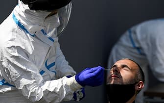 A Kosovar football referee gets tested for COVID-19 at the Fadil Vokrri Stadium in Pristina on May 30, 2020. - Since March 14, all sporting events have been postponed in Kosovo, due to the risk of the Coronavirus pandemic. (Photo by Armend NIMANI / AFP) (Photo by ARMEND NIMANI/AFP via Getty Images)