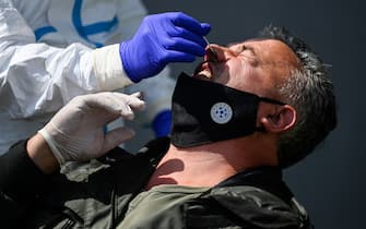 A Kosovar football referee gets tested for COVID-19 at the Fadil Vokrri Stadium in Pristina on May 30, 2020. - Since March 14, all sporting events have been postponed in Kosovo, due to the risk of the Coronavirus pandemic. (Photo by Armend NIMANI / AFP) (Photo by ARMEND NIMANI/AFP via Getty Images)